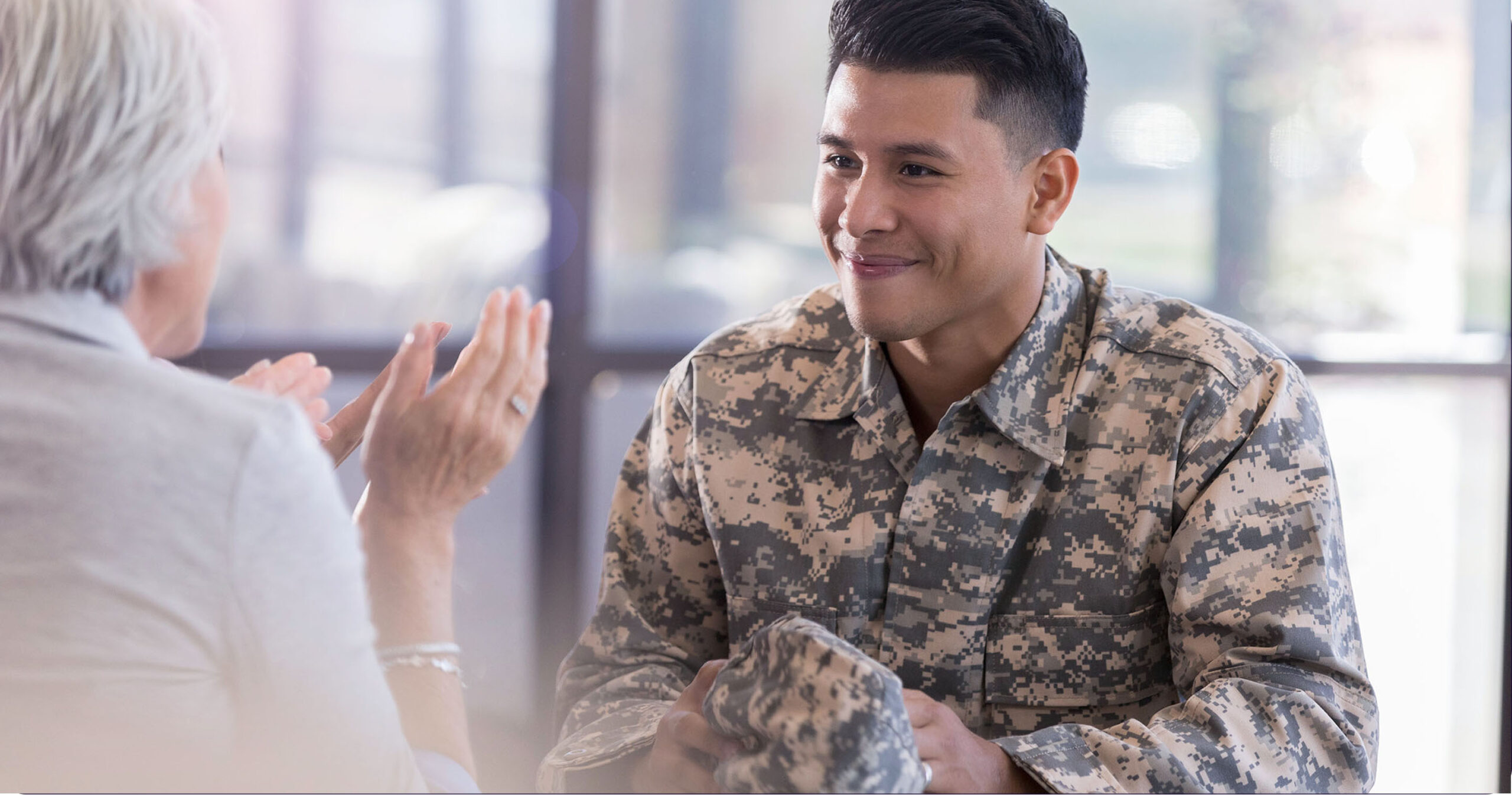 Veteran talking to healthcare professional